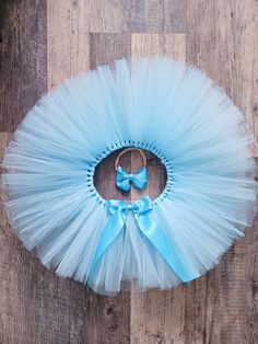 This gorgeous light blue tutu skirt is perfect to add to your little one's big day Makes a wonderful gift for Birthday, a photoshoot or just to dress up!!  It would also be great as a baby shower gift!! The tulle of the tutu is hand knotted on a double side satin ribbon to be tie in a bow at the back or the front.   I will need your little one's waist measurement, all around the waist where the tutu will sit. Waist up to 21". If you prefer a simple bow as hair accessory, add the satin bow nylon Blue Princess Tutu Dress For First Birthday, Princess Style Blue Tutu Dress For First Birthday, Light Blue Princess Tutu Dress For Birthday, Blue Tulle Skirt Tutu Dress For Birthday, Cute Blue Tutu Dress For First Birthday, Cute Blue Tutu Dress For Birthday, Blue Tutu Skirt, 1rst Birthday, Simple Bow