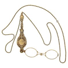 This vintage collectible lorgnette necklace is crafted in solid 14k yellow gold. It is very well detailed and features floral patterns throughout with an olympic style torch on both sides of the design. The lorgnette slides on a long, 35 inches rope link chain. The original finish and patina are intact and the piece remains in excellent overall physical and mechanical condition and is a great add to your collection. Enjoy :) Material: Solid 14k Yellow Gold (maybe slightly under karat due to age of production) Weight: 56.16 Grams Chain Type: 2.8mm Rope Link Chain Length: 35 Inches Clasp: Spring Ring Lorgnette Overall Length: 114.3mm (4.5") Lorgnette Overall Width: 28.4mm (1.1") Thickness: 12.1mm Condition: Vintage collectible piece in excellent overall physical and mechanical condition. Ori Vintage Gold-tone Oval Link Necklace, Vintage 14k Gold-tone Necklace, Vintage 14k Gold Jewelry With Lobster Clasp, Vintage 14k Gold Necklace With Lobster Clasp, Vintage Gold-tone Engraved Necklace, Vintage Oval Jewelry With Adjustable Chain, Victorian Brass Jewelry With Adjustable Chain, Vintage 14k Gold Necklace With Adjustable Chain, Vintage Gold-tone Jewelry With Adjustable Chain