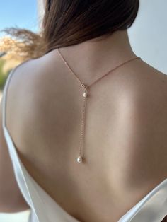 This delicate and romantic back drop chain is perfect for your backless / open back bridal gown or evening dresses. Made from genuine baroque pearl and dainty shinny cable chain. Either wear as a back drop chain or lariat chain, both are gorgeous and elegant.   Custom order is welcomed. Please send me a message.  Available in 925 sterling silver / rose gold plated copper / gold plated copper material.  Model wears 45cm back chain. ♥Lead and nickel free ♥Made from genuine freshwater pearls ♥Custo Delicate Bridal Necklace With Adjustable Chain For Party, Elegant Teardrop Backdrop Necklace With Delicate Chain, Elegant Drop Backdrop Necklace For Wedding, Teardrop Pendant Drop Necklace With Pearl Chain For Wedding, Elegant Teardrop Pendant Lariat Necklace For Wedding, Wedding Drop Necklace With Pearl Chain And Teardrop Pendant, Wedding Teardrop Drop Necklace With Pearl Chain, Wedding Lariat Backdrop Necklace With Pearl Charm, Elegant Wedding Drop Necklace With Adjustable Chain