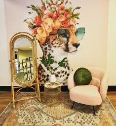 a cheetah with flowers on it's head sitting next to a pink chair