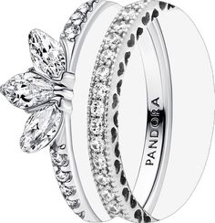 two wedding rings with diamonds on each side and the words panda written in black ink