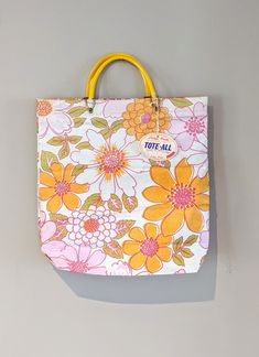 Vintage Lady's Pride Tote-all bag. Pink, yellow, and orange floral design with yellow handles. Tag is still on and the tote is in overall great shape, but there are a few small dirt smudges on it that can likely be cleaned off (see photos). FREE SHIPPING! Yellow Floral Print Travel Bag, Yellow Floral Print Everyday Bag, Everyday Yellow Floral Print Bags, Vintage Yellow Tote Shoulder Bag, Yellow Floral Print Bags For Daily Use, Vintage Yellow Bag For Everyday Use, Yellow Floral Print Bag For Daily Use, Vintage Yellow Shoulder Bag For Daily Use, Vintage Yellow Bag For Everyday