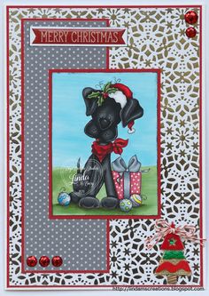 a christmas card with a black dog holding a present in it's paws and the words merry christmas