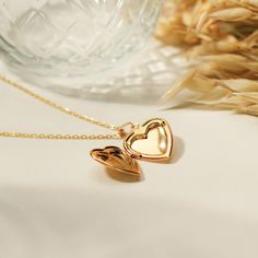 Dainty vintage inspired gold locket necklace, featuring a heart locket with secure closure on a dainty gold chain necklace. ∙DETAILS Chain: 16'' + 2'' Heart locket: 20mm x 18mm Made of 925 Sterling Silver Plated with 18K gold Waterproof & hypoallergenic ∙SHIPPING IMPORTANT: before placing an order, please double check that your address is correct to avoid any delays. Shop more one-of-a-kind pieces: https://www.etsy.com/shop/SeraphinJewelry Free express shipping on all orders! Thank you so much f Heart Shaped Locket Necklace For Valentine's Wedding, Double Heart Locket Necklace For Valentine's Day Wedding, Heart-shaped Locket Necklace For Wedding On Valentine's Day, Heart-shaped Locket Necklace For Wedding, Valentine's Day, Heart Shaped Locket Necklace For Wedding On Valentine's Day, Double Heart Locket Necklace For Wedding On Valentine's Day, Double Heart Locket Necklace For Wedding And Valentine's Day, Charming Gold Heart-shaped Jewelry, Charming Gold Wedding Jewelry