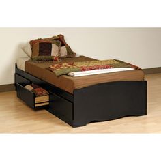 a bed with two drawers underneath it