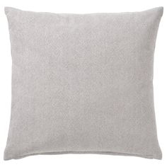 a light gray pillow with white dots on the front and back, sitting on a white background