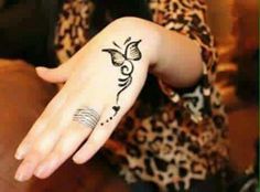 a woman's hand with a tattoo on it