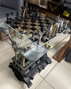 Title : Engine Table with Chess Set // Engine Block Table / Gearhead  / Man Cave / Personalized!      We produce decoration items from real car parts. Our products are clean and stainless. It will ship within 5-15 business days and will be delivered to your address between 1 and 3 days. Times are estimates, may come much faster. We are sure that it will add a different perspective to your home or workplace. ATTENTİON: Engine block may change. We choose the best for you. table glass is included i Engine Block Ideas, Engine Table Ideas, Engine Block Table, Man Cave Ideas Room, Mechanic Shop Decor, Classy Man Cave, Engine Table, Man Cave Pub, Car Parts Decor