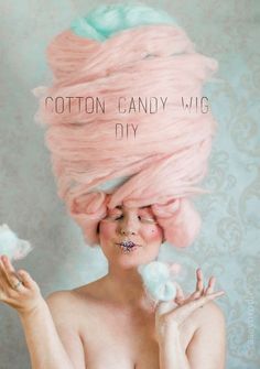 a woman with pink hair has cotton candy on her head