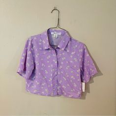 Brand New With Tags. Bright Purple Color. Cute Floral Print. Semi Cropped Length. Button Front Design. Purple Crop Top Outfit, Seersucker Top, Wrap Tank Top, Yellow Floral Top, Purple Crop Top, Semi Cropped, Nike Long Sleeve, Black Sleeveless Top, Button Front Top