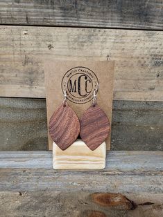 These are beautiful Texas Mesquite Earrings hand cut using a bandsaw and/or scroll saw, and hand sanded. Was not made with a cnc machine. Band Saw, Charcuterie Boards, Earring Hooks, Black Walnuts, Wood Earrings, Black Walnut, Jump Rings, Leaf Pattern