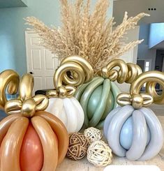 there are many balloons in the shape of pumpkins