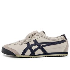 Introducing the Onitsuka Tiger MEXICO 66, a retro-inspired update on a classic sneaker. This sneaker is perfect for those who want to channel their inner '68 Olympian or simply add a touch of retro style to their everyday looks. The leather upper, suede paneling and serrated eyestays are reminiscent of the original design, while the contrast labels and midfoot stripes give the shoe a modern twist. The two-tone rubber sole is reissued with classic rubber tread, making this sneaker both stylish and practical. (SNKR/Cozy/Retro/Casual/Unisex/Breathable) Mens Lifestyle Shoes, Men’s Sneakers, Mexico 66 Onitsuka, Onitsuka Tigers, Shoes To Buy, Casual Shoes Women Sneakers, Dress Sneakers, Everyday Shoe, Tiger Mexico 66