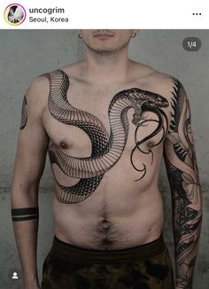 a man with a snake tattoo on his chest