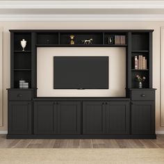 a black entertainment center with bookshelves and a flat screen tv mounted on the wall