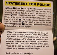 someone is holding up a police statement card