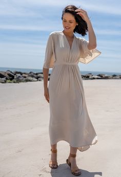 V-neck Maxi Dress With Elastic Sleeves For Daywear, Summer Wrap Dresses With Draped Sleeves, Summer Wrap Dress With Draped Sleeves, Versatile Stretch Maxi Dress For Spring, Elegant Wrap Dress With Kimono Sleeves For Beach, Elegant Summer Rayon Wrap Dress, Spring Draped Rayon Dress, Spring Rayon Draped Dress, Versatile Solid Color Maxi Dress For Summer