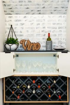 a wine rack with many bottles in it