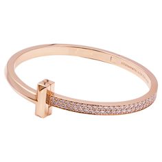 Tiffany & Co. T1 Hinged Bangle in Rose Gold 18k rose gold with round brilliant diamonds Carat total weight 2.18 Size medium, Fits wrists up to 6.25" Retail: $27,000.00 Tiffany Bangle Tiffany & Co., Modern Rose Gold Diamond Bracelet For Formal Occasions, Luxury Pink Gold Bracelet For Formal Occasions, Luxury Rose Gold Diamond Bracelet With Pave Setting, Luxury Rose Gold Diamond Bracelet With Polished Finish, Luxury Rose Gold Diamond Bangle Bracelet, Luxury Pink Gold Bracelet For Formal Events, Luxury Pink Gold Bracelets For Formal Occasions, Luxury Rose Gold Bracelet With Polished Finish