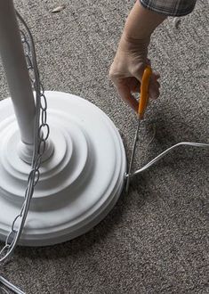 a person standing over a white object on the ground