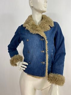 "Warm denim jacket, vintage denim jacket, women's size small Measurements:  Shoulder 16\"/sleeve(uncuffed)22\"/bust (armpit-armpit)17\"/waist 16\"/bottom width 16.5\"/length 20\" Mannequin measurements:  5'8\", bust 34\", waist 25\", hip 33\" Please note that vintage clothing sizes can vary greatly.  The Measurements provided  are approximate and are taken lying flat.  I suggest taking a similar garment from your wardrobe and measure it while lying flat.  This way you can compare measurements.  All of our pieces are genuine vintage. Don't forget to enlarge the photos and take a closer look at this genuine vintage item!! I will ship your item off within 1-2 business days. I ship expedited for all Canadian and US orders. All other destinations world wide will be shipped surface and therefore 70s Denim Puffy Coat, Denim Blue Winter Outerwear With Buttons, Winter Denim Blue Outerwear With Buttons, Retro Long Sleeve Denim Outerwear, Winter Washed Denim Collared Jacket, Winter Button Closure Denim Jeans, Vintage Denim Outerwear For Winter, Fitted Denim Winter Outerwear, Winter Fitted Denim Outerwear