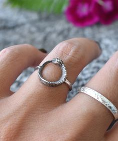 "Ouroboros Snake Circle Ring details: -Solid .925 sterling silver -Ourobors circle measures 12.5mm round, 1.5mm width band -Lightly oxidized -US sizes 6-8 Looking for a last minute or unique Christmas gift? Visit our \"READY TO SHIP\" section here, ships out in one business day https://www.etsy.com/shop/AWildViolet?section_id=23587515 Connect with us on Instagram @a_wild_violet for sales and giveaways! **All items are in stock and ship within 2-5 business days from received payment (excluding Sa Handmade Adjustable Open Snake Ring, Adjustable Snake-shaped Symbolic Rings, Adjustable Snake Symbolic Ring, Handmade Sterling Silver Snake-shaped Ring, Unique Sterling Silver Snake Ring, Handmade Adjustable Snake Ring For Promise, Unique Hand Forged Snake Ring As Gift, Unique Hand Forged Snake Ring, Silver Hand Forged Snake Ring Gift