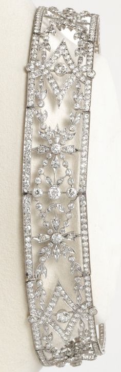 An Edwardian Platinum and Diamond Choker Necklace, Tiffany & Co., Circa 1900-1910. Composed of openwork links of foliate and garland design set with old European-cut and single-cut diamonds, signed Tiffany & Co. With original fitted lavender-colored case signed Tiffany & Co., New York, Paris, London. #Tiffany #Edwardian #choker Edwardian Choker, Cute Choker Necklaces, Garland Design, Charleston Style, Queens Jewels, Tiffany Art, Diamond Choker Necklace, Beautiful Accessories, Diamond Choker