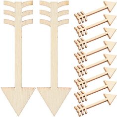 several wooden arrows and one is cut out to make an arrow shape with different sizes