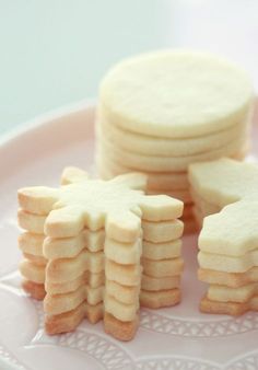 several cookies are arranged on a pink plate