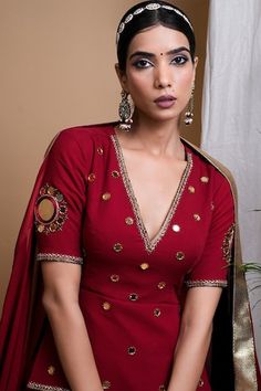 Maroon attached cancan lehenga with gota lace detailing on hem. Paired with a short kurta with hand embroidered mirrors, all over border work and a dupatta with hand embroidered gota lace on border with attached fringes. - Aza Fashions Festive V-neck Sets For Reception, Festive V-neck Palazzo Set For Wedding, Wedding Palazzo Set With Dupatta And V-neck, Bollywood V-neck Sets With Mirror Work, Navratri V-neck Mirror Work Sets, Festive V-neck Sharara With Dupatta, Festive V-neck Lehenga, V-neck Lehenga With Mirror Work For Wedding, Festive Gota Work Sets With V-neck