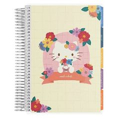 a spiral notebook with an image of a hello kitty on the cover and flowers around it