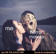 a woman kissing a man wearing a mask with the words me horror movies on it