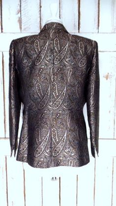 "Vintage Kasper paisley jacquard brocade tapestry blazer/brown/black/gold tapestry jacket/12 petite Measurements... taken flat -marked size: 12 petite -pit to pit: 22\" -length: 25.5\" -sleeve: 23\" Features... -classic paisley brocade -great texture and feel -open front -fully lined -shoulder padding -Kasper Condition... -excellent vintage condition QA1717" Fall Party Brocade Outerwear, Formal Brocade Outerwear For Fall, Elegant Fitted Outerwear With Paisley Print, Elegant Fitted Paisley Print Outerwear, Fitted Brocade Outerwear For Fall, Fitted Brocade Formal Outerwear, Formal Fitted Brocade Outerwear, Fitted Brocade Outerwear For Festive Season, Tapestry Jacket