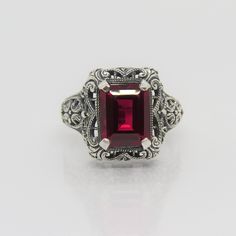 Sterling Silver Ruby Filigree Ring...Marked 925...Total of weights 4.8grams.. Size 9...Measure of Face 15.6mm...It's in very good condition Classic Formal Ruby Ring Stamped 925, Classic Filigree Ring For Formal Occasions, Formal Ruby Ring In Sterling Silver Stamped 925, Formal Ruby Ring In Sterling Silver, Classic Silver Ruby Ring Stamped 925, Classic Ruby Ring In Sterling Silver, Sterling Silver Ruby Ring With Intricate Design For Anniversary, Anniversary Ruby Ring With Intricate Design In Sterling Silver, Anniversary Sterling Silver Ruby Ring With Intricate Design