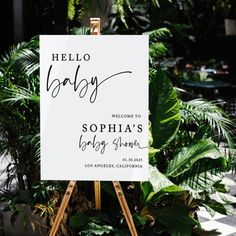 an easel with a sign that says oh baby, welcome to the couple's baby shower