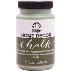 a jar of chalk paint sitting on top of a white table