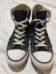 Converse Youth Chuck Taylor All Star Gray. Running Shoes Sneakers. Size 2. Unisex. High Tops. Some signs of wear. Converse logos worn off in places. See photos for more details as these are the shoes that will be shipped to you. No holes or tears. Good used condition. Still lots of wear left!