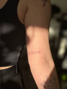 a woman with a tattoo on her arm