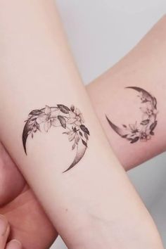 two people with matching tattoos on their arms