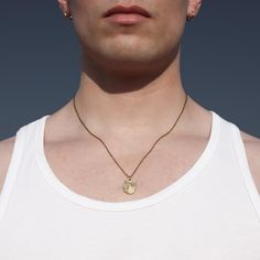 DESCRIPTION: Print is a stylish and understated mini chain pendant necklace. Crafted from gold IP stainless steel, this piece will resist tarnish and will not turn skin green. It features a minimalist aesthetic and exudes a sense of legacy. With multiple styling options, it gives you the freedom to express your individual style. DETAILS: 18 inches full length IP gold stainless steel tarnish resistant minimalist aesthetic unisex FIT: Model wears a 15 1/2 inch collar  IG: sib.somewhereinbetween WEB: www.thesibshop.com Minimalist Everyday Charm Necklace With Coin Pendant, Minimalist Coin Necklace With Adjustable Chain, Everyday Minimalist Charm Necklace With Coin Pendant, Minimalist Medallion Chain Necklace With Delicate Chain, Minimalist Tarnish-resistant Coin Necklace, Everyday Minimalist Medallion Chain Necklace, Minimalist Brass Necklace Tarnish Resistant, Minimalist Brass Coin Necklace With Round Pendant, Minimalist Yellow Gold Coin Necklace