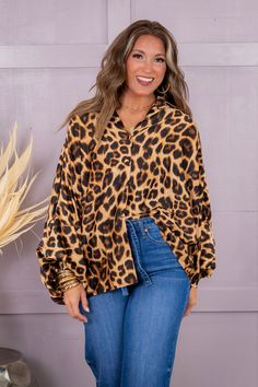 Crafted from luxurious satin material, this button-down blouse showcases a fierce leopard print. With long sleeves and a comfortable one size fit, this blouse effortlessly adds a touch of wild to any wardrobe. Show off your fashion savvy with this trendy and versatile top. Erin is wearing a one size One Size Fits Most 100% Polyester One Size Measurements Length: 24" Bust: 26" Washing Instructions Hand wash cold separately. Do not bleach. Hang to dry Oversized Leopard Print Top, Trendy Long Sleeve Leopard Print Blouse, Fall Leopard Print Button-up Blouse, Chic Leopard Print Blouse For Fall, Oversized Leopard Print Tops With Long Sleeves, Cheetah Top, Walk On The Wild Side, Satin Material, Walk On