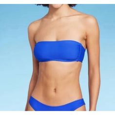 Wild Fable - Women's Pull Over Bandeau Bikini Top - Blue - Extra Small(0-2) -Size: Extra Small(0-2) Women's -Measurements: Please See Photos Above For All Measurements -Material: Please See Photos For Materials Tag -Condition: New With Tags -Colors May Slightly Vary From Photography Lighting -Will Ship In One Business Day Package Weight: 8 Oz Package Dimensions: 9 X 6 X 2 In I Ship Items Out Every Day So Expect A Quick Delivery! Please Feel Free To Ask Any Questions You May Have. I Answer Most Q Blue Seamless Strapless Tube Top, Blue Strapless Seamless Tube Top, Strapless Blue Swimwear For Sunbathing, Blue Strapless Stretch Swimwear, Blue Strapless Swimwear With Built-in Bra, Blue Tube Top For Beach Season Pool, Blue Tube Top For Pool And Beach Season, Blue Tube Top For Summer Sunbathing, Blue Strapless Tube Top For Sunbathing