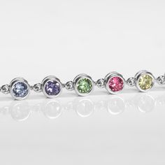 Our Ella Medical ID Bracelet sparkles with individually linked, round cubic zirconia crystals. Offered here in multicolored cubic zirconias set in silver bezels, Ella is a minimalist design with maximum impact. Pair yours with your favorite custom-engraved medical ID tag to wear alone or with up to two additional bracelet strands for a layered look.

This classic women�s medical alert tennis bracelet pairs with your custom engraved medical ID tag. Engrave any medical conditions, including breast Cubic Zirconia Birthstone Bracelets, Silver Cubic Zirconia Bracelet Channel Set, Silver Cubic Zirconia Bracelets Channel Set, Round Jewelry With Handset Cubic Zirconia Stones, Round Cubic Zirconia Jewelry With Handset Stones, Channel Set Cubic Zirconia Tennis Bracelet, Cubic Zirconia Channel Set Tennis Bracelet, Silver Tennis Bracelet With Channel Set As Gift, Silver Channel Set Tennis Bracelet As Gift