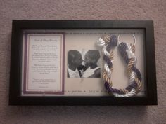 a framed photo with two bracelets in it