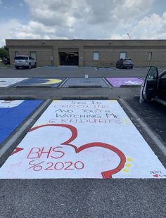 the parking lot has been painted with different colors and numbers for various events, including an event