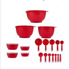 red plastic mixing bowls and spoons on white background