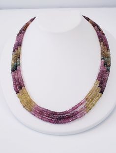 Tourmalines are given a center stage to turn on their full-color show. From dark greens to yellows and pinks, tourmaline has it all. The 3 strands multicolor necklace is eager to transmit to you this gemstones' qualities: tourmaline attracts inspiration, compassion, tolerance, and prosperity. *Natural Multi Tourmaline Rondelle Faceted Beads, *Stones: Watermelon Tourmaline *Clasp: Surgical steel *End to end Length: 18 Inches *Bead Size: 3.5-3.8 mm approx. *Carat wt.: 204.58Ct FREE Shipping and Gi Multicolor Tourmaline Multi-stone Necklace, Multicolor Multi-stone Tourmaline Necklaces, Multicolor Multi-stone Tourmaline Necklace, Multicolor Tourmaline Faceted Beads Necklace, Multicolor Tourmaline Gemstones In Round Shape, Multicolor Tourmaline Gemstone Beads Necklaces, Multicolor Round Tourmaline Gemstones, Multicolor Tourmaline Beaded Necklace With Faceted Beads, Multicolor Faceted Tourmaline Necklaces