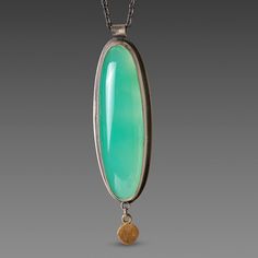 This necklace features a luminous, smooth chrysoprase wrapped in 22k gold and accented with a single hammered 22k gold disk. Oxidized sterling silver chain. Pendant, including drop, measures approximately 1/2 inch x 1 3/4 inches. Matte finish. Chrysoprase Necklace, Bling Ideas, Silver Chain Pendant, Gold Disc, Petrified Wood, Oxidized Sterling Silver, Chain Pendant, 22k Gold, Sterling Silver Chain