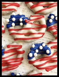 red, white and blue decorated donuts with icing in the shape of an american flag