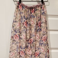 Nwt: Anthropologie-Raga Maxi Skirt Size Small Colors: Floral Print (Cream, Blue, Pink, Green Etc.) *Maxi Skirt *Tassel Drawstring Waist *Elastic Waistband *Detailing Bottom Tier *Light Weight *Flowy *Shell 100% Polyester *Lining 100% Cotton *Made In India Approx. Measurements Waist 11.75" Length 35" The Vibrant Pieces In The Raga Collection Celebrate The Connections Between The Family-Owned-And-Operated Label's Roots In India And Their Home Base In Venice Beach, Blending The Brilliant Colors And Feminine Beige Floral Print Bottoms, Feminine Beige Bottoms With Floral Print, Summer Pink Relaxed Maxi Skirt, Pink Floral Print Summer Maxi Skirt, Summer Pink Relaxed Fit Maxi Skirt, Spring Beige Maxi Skirt With Elastic Waistband, Beige Maxi Skirt With Elastic Waistband For Spring, Beige Elastic Waistband Maxi Skirt For Spring, Summer Pink Lined Maxi Skirt